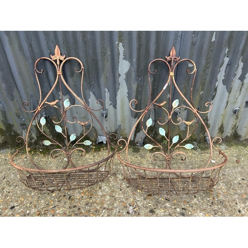 177 - A pair of french metal work wall baskets. 60h w49