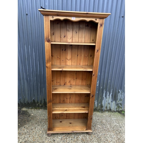 180 - A tall open fronted pine bookcase 82x186
