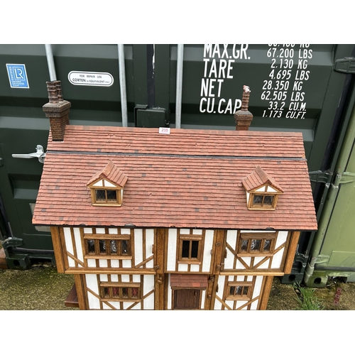 235 - A hand made Tudor style dolls house loaded with furnishings 90x50 x80