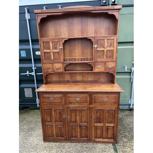 244 - A large oak Dresser with plate rack back and compartment top  136x48x216