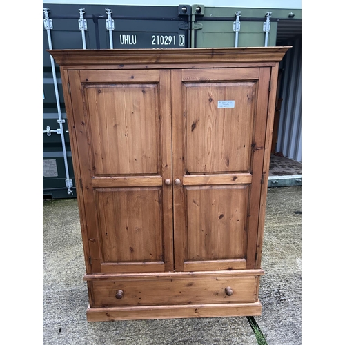 251 - A small pine wardrobe with drawer