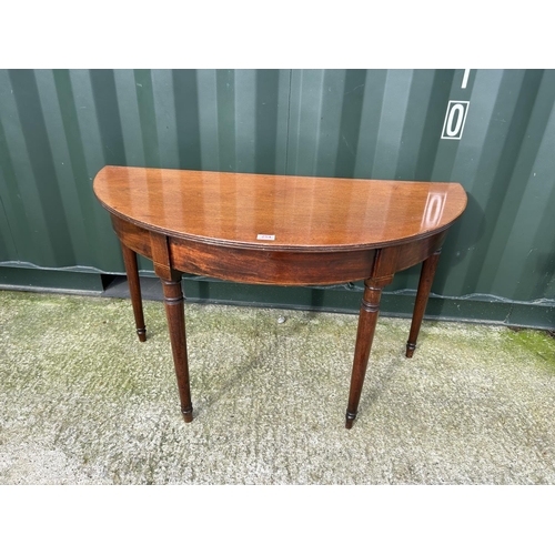 255 - A mahogany Demi lune hall table