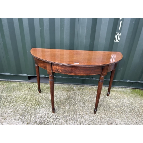 255 - A mahogany Demi lune hall table