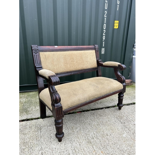 260 - A mahogany framed settle bench seat with gold upholstery 118cm wide