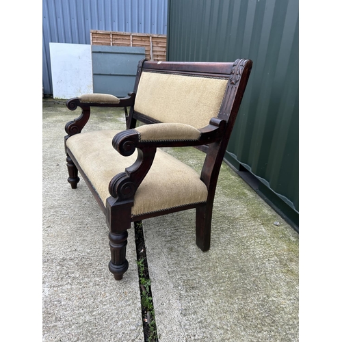 260 - A mahogany framed settle bench seat with gold upholstery 118cm wide