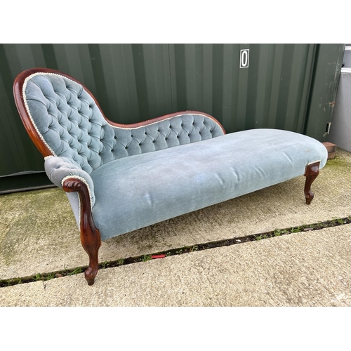 261 - A Victorian style mahogany, blue upholstered chaise longue