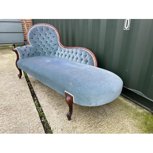 261 - A Victorian style mahogany, blue upholstered chaise longue