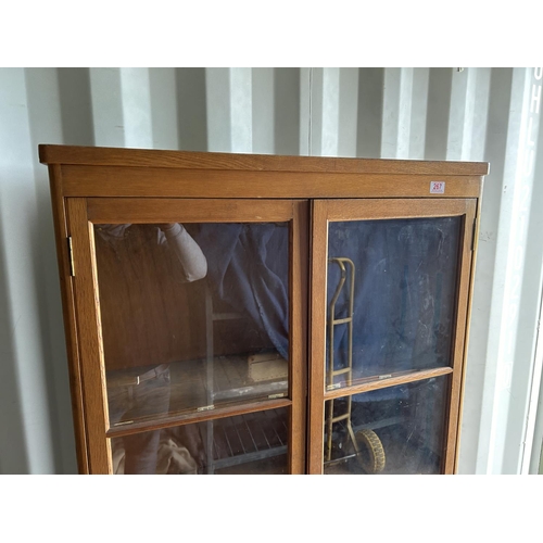 267 - An early 20th century oak glazed cabinet 90x30x174