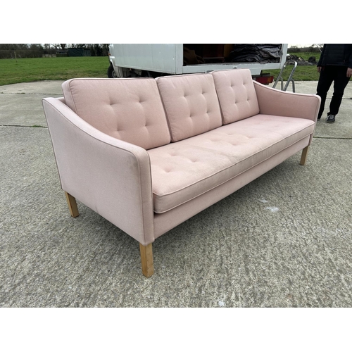 268 - A DANISH STYLE pale pink three seater sofa