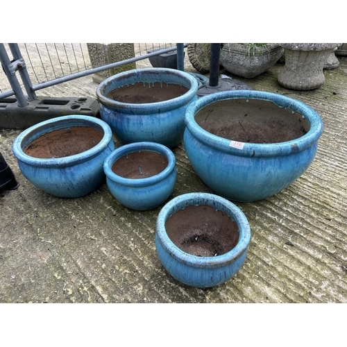 311 - A set of five blue glazed garden pots