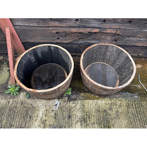 317 - A pair of Scottish oak half whisky barrel planters 2ft round