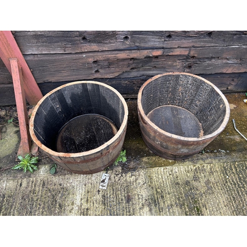 317 - A pair of Scottish oak half whisky barrel planters 2ft round