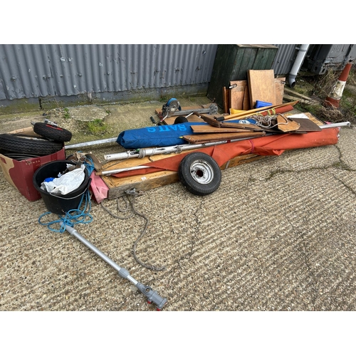 32 - A kit assembly rowing boat, with oars, sail, wheels and other accessories