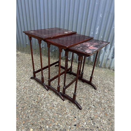 35 - A mahogany nest of three tables AF to tops