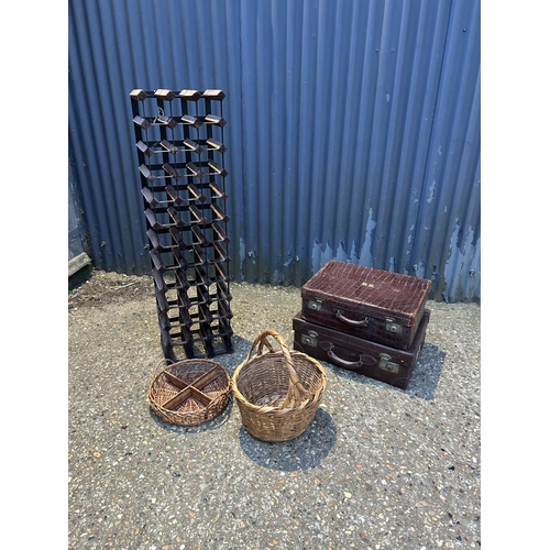 40 - Two vintage leather cases, two baskets and a wine rack