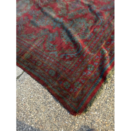42 - A large Turkish pattern red carpet 360x 270