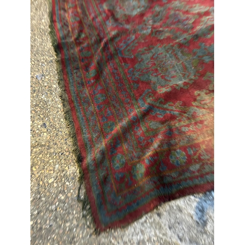 42 - A large Turkish pattern red carpet 360x 270
