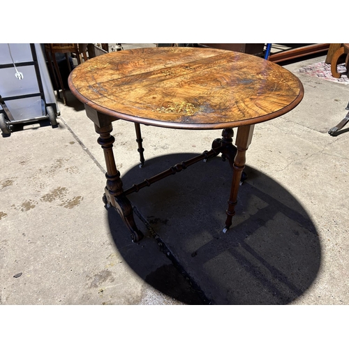 45 - A Victorian walnut inlaid Sutherland table