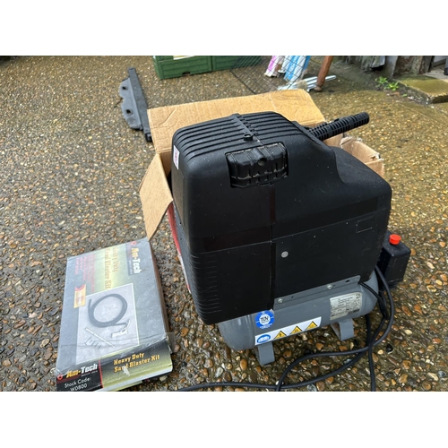 49 - A pressure washer together with a compressor and sand blaster kit