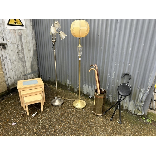 75 - Two standard lamps, brass umbrella stand with sticks, and a modern nest of three
