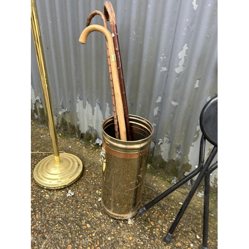 75 - Two standard lamps, brass umbrella stand with sticks, and a modern nest of three