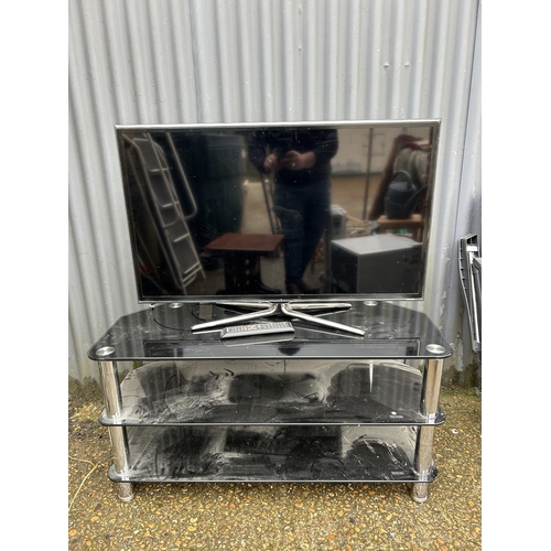 78 - A Samsung 40 inch tv on black glass stand