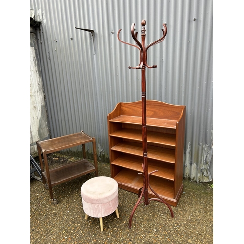 85 - A teak Parker knoll bookcase with oak trolley, pink stool and coat hooks