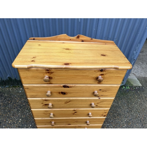 87 - A pine tallboy chest of six