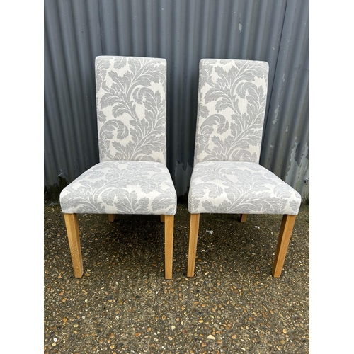 89 - A pair of modern high back dining chairs