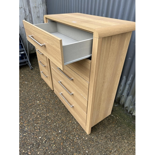 90 - A modern light oak effect tallboy chest of drawers with matching bedside