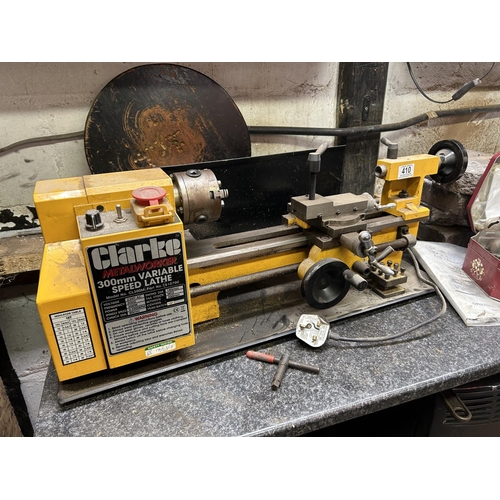 410 - A Clarke metalworker 300mm variable speed lathe 240v - with manual and tin of tools