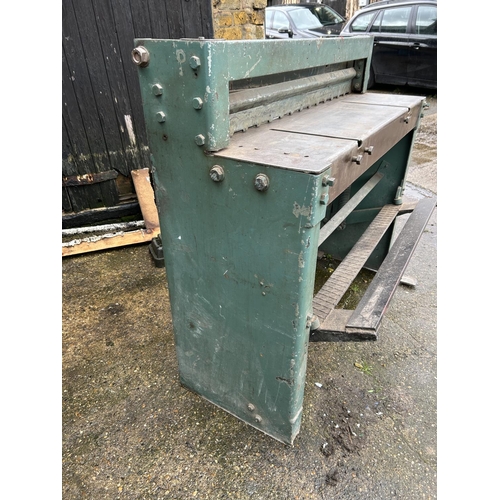 412 - A heavy duty sheet metal guillotine by F J EDWARDS; 114cm Total width, floor standing