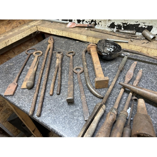 463 - A crate of anvil stakes and blacksmiths tools