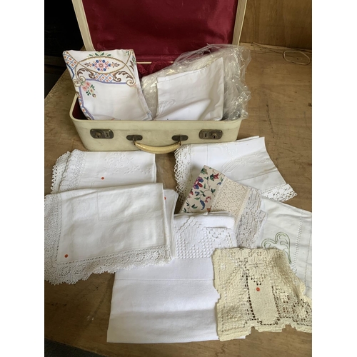 560 - White case of vintage linen