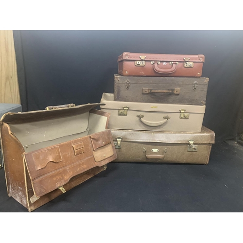 593 - 3 vintage suitcases and a briefcase