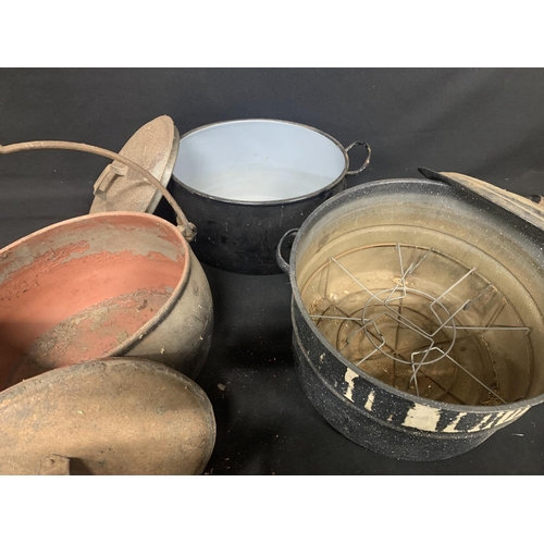 596 - Two large enamel pans diameter 42 cms & 37 cms and one cast iron cauldron diameter 37 cms