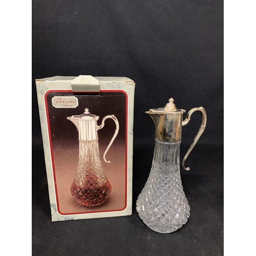 628 - Boxed plated claret jug