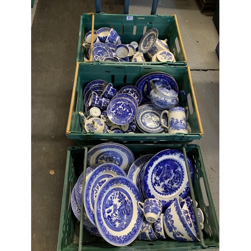 811 - Three crates of willow pattern and other blue and white china (crates not included)