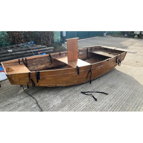 32 - A kit assembly rowing boat, with oars, sail, wheels and other accessories