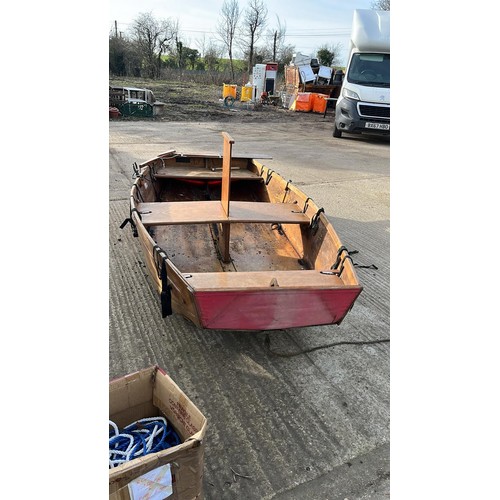 32 - A kit assembly rowing boat, with oars, sail, wheels and other accessories