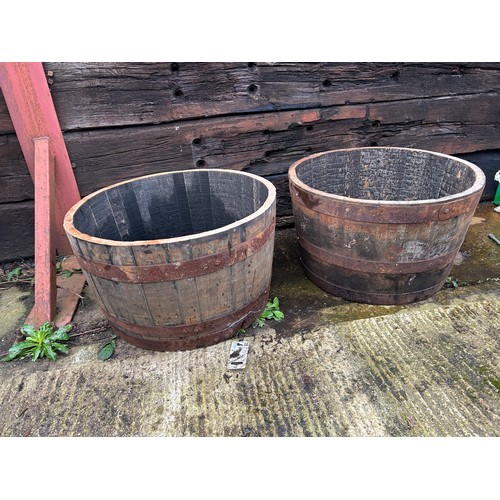 50A - A pair of Scottish oak half whisky barrel planters 2ft round