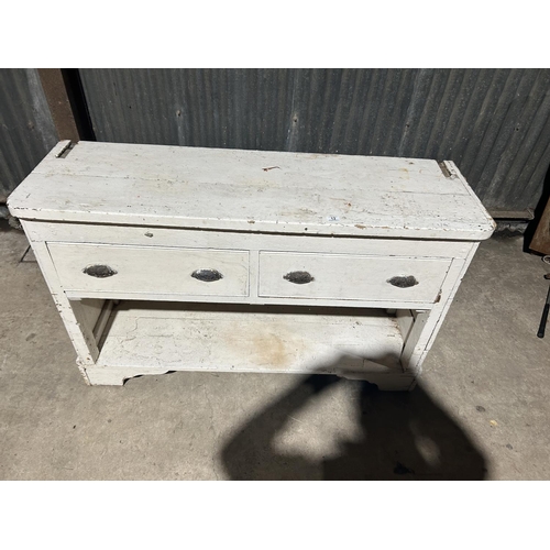 12 - A white painted two drawer dresser base 145x47x90 cms