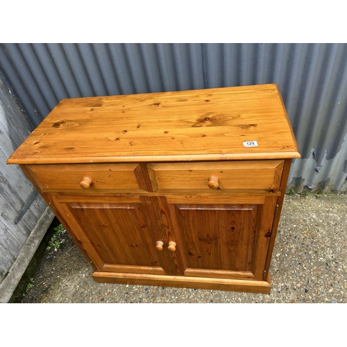 129 - A solid pine two drawer sideboard