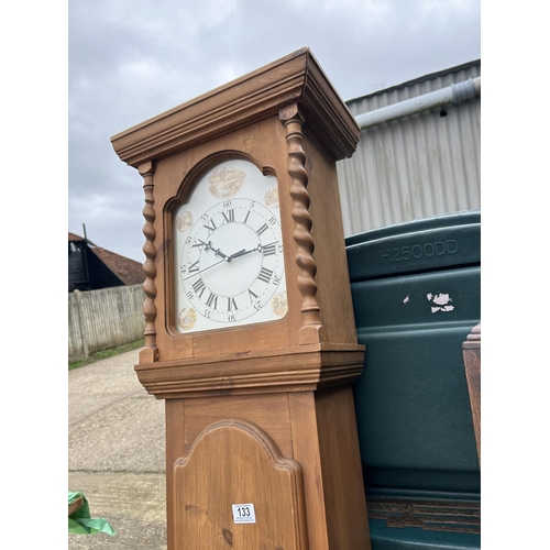 133 - A modern pine long case clock together with an oak cased long-case clock