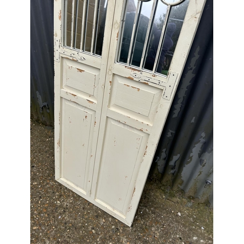 143 - A white painted vintage style shutter door mirror 180cm tall