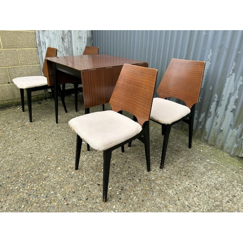 151 - A G plan or similar retro kitchen table with four chairs