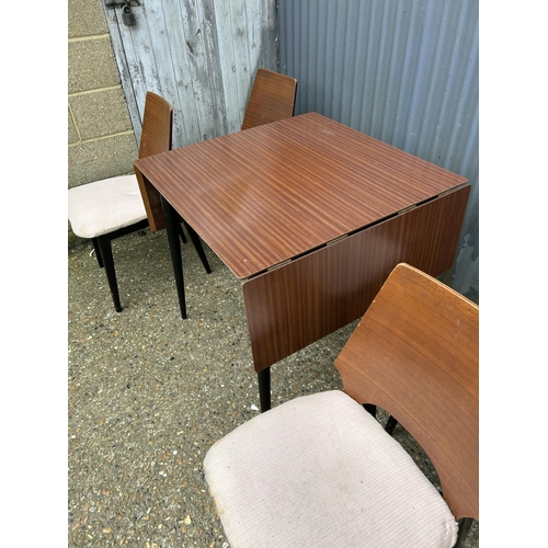 151 - A G plan or similar retro kitchen table with four chairs