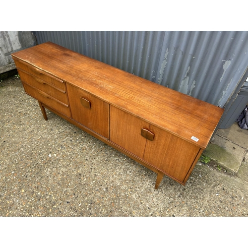 155 - A mid century teak sideboard