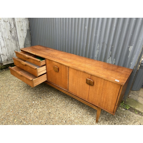 155 - A mid century teak sideboard