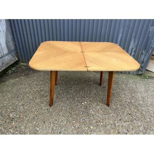 167 - A retro light oak fold over table